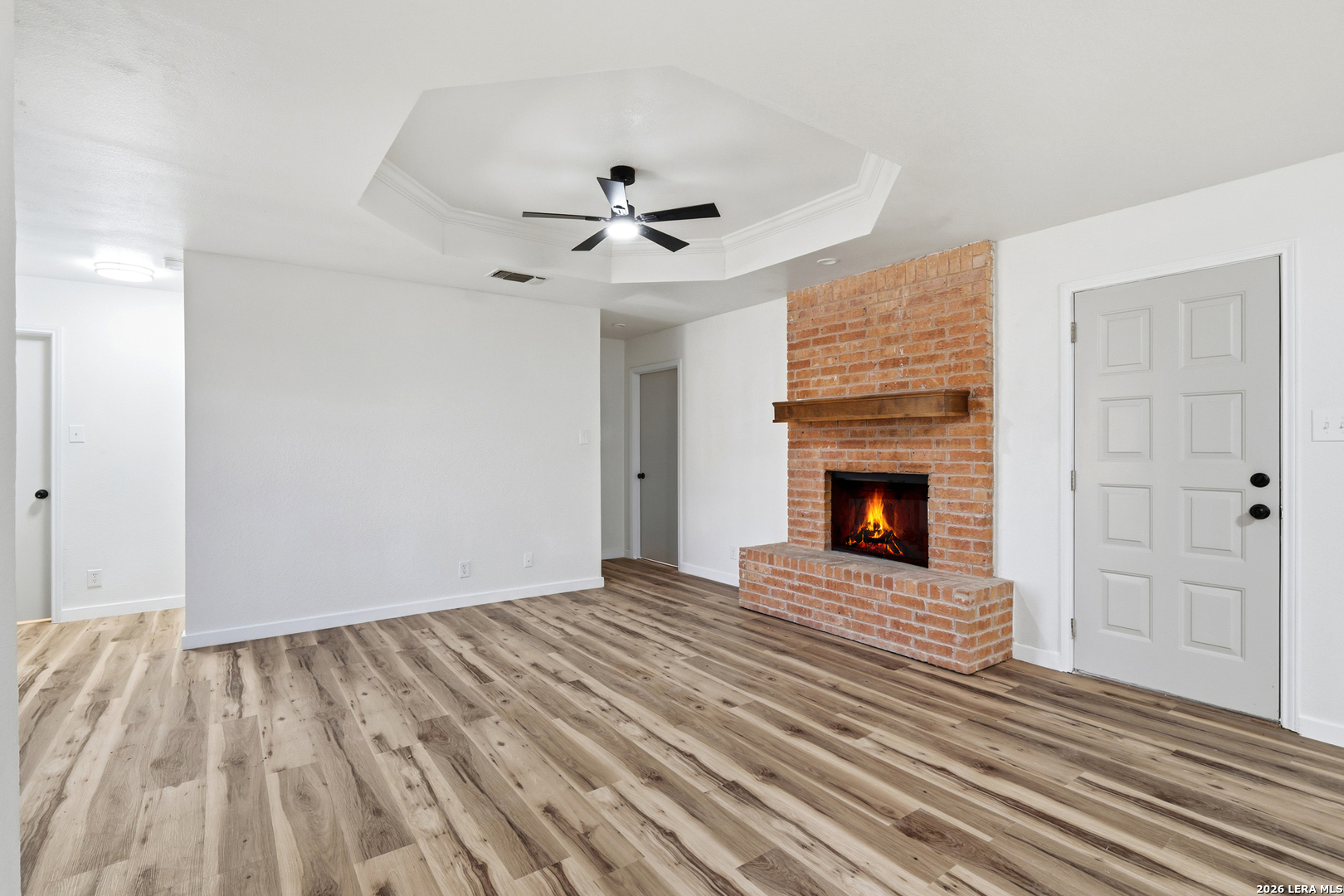 1300 Cyrus Schertz, TX 78154 - Photo 5 of 30 a view of empty room with wooden floor and fireplace
