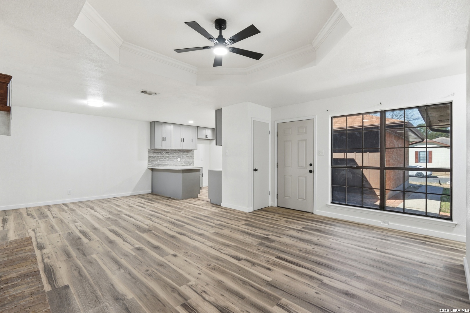 1300 Cyrus Schertz, TX 78154 - Photo 7 of 30 a view of empty room with wooden floor and windows