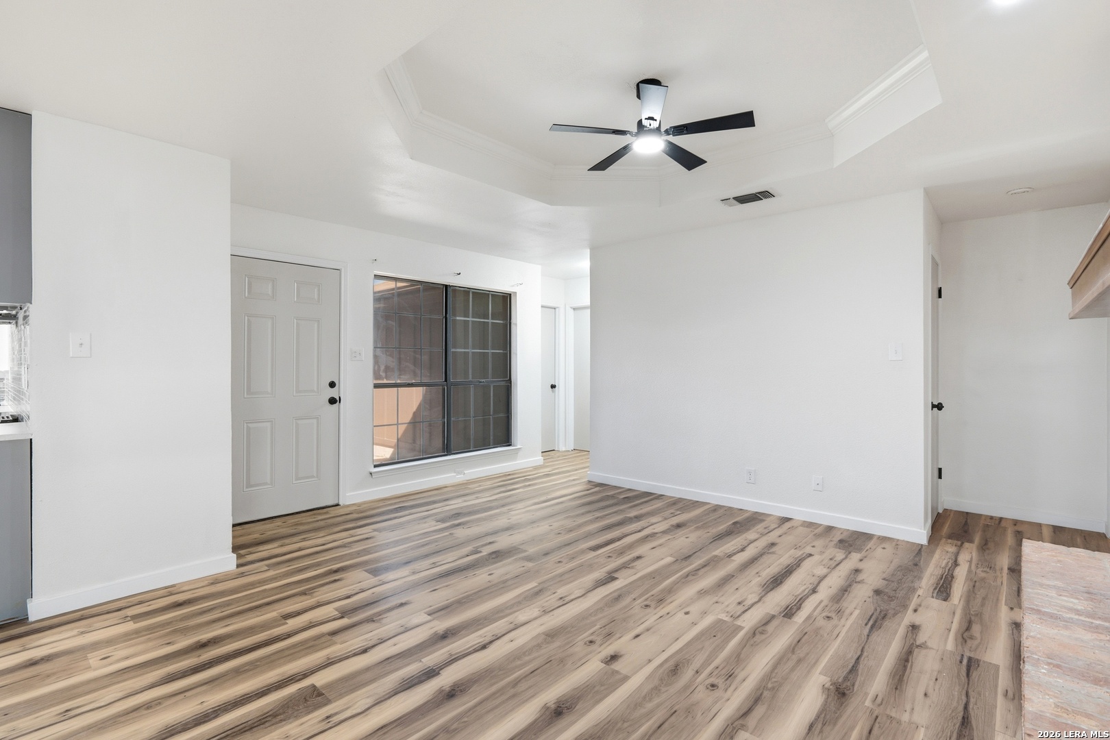 1300 Cyrus Schertz, TX 78154 - Photo 8 of 30 a view of empty room with wooden floor and fan