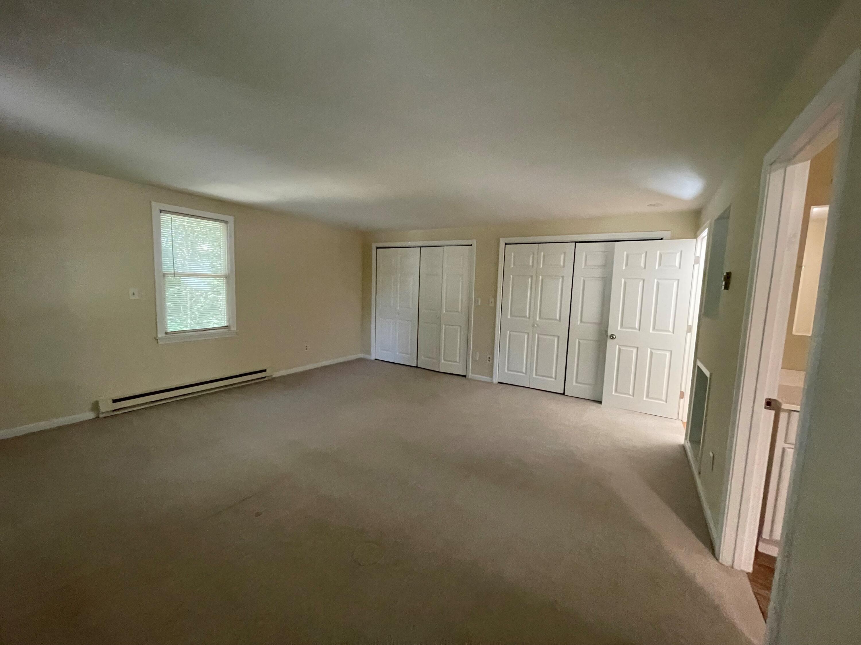 23 Radcliffe Road Mashpee, MA 02649 - Photo 14 of 20 an empty room with a empty space and windows