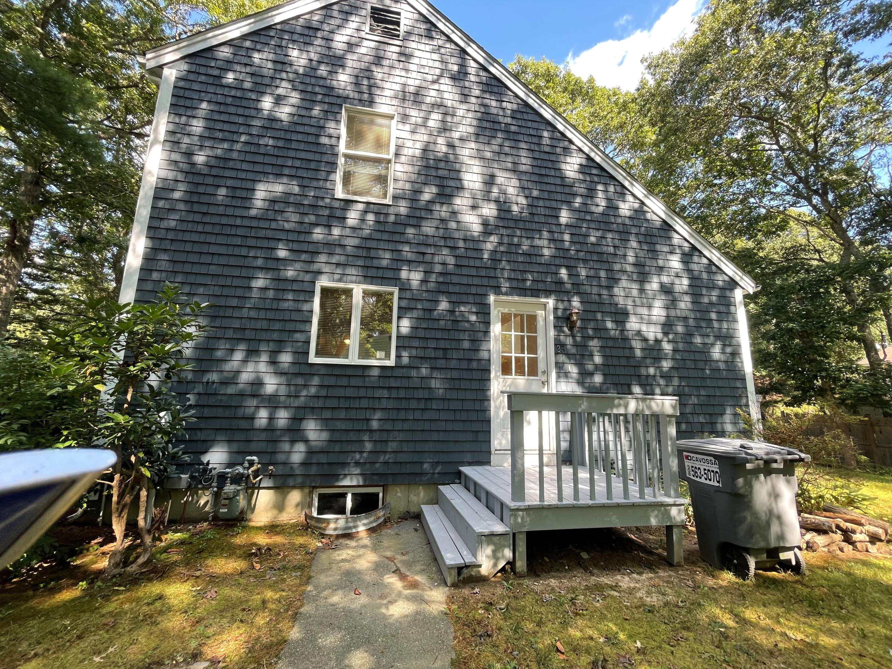 23 Radcliffe Road Mashpee, MA 02649 - Photo 16 of 20 a view of a house with a balcony