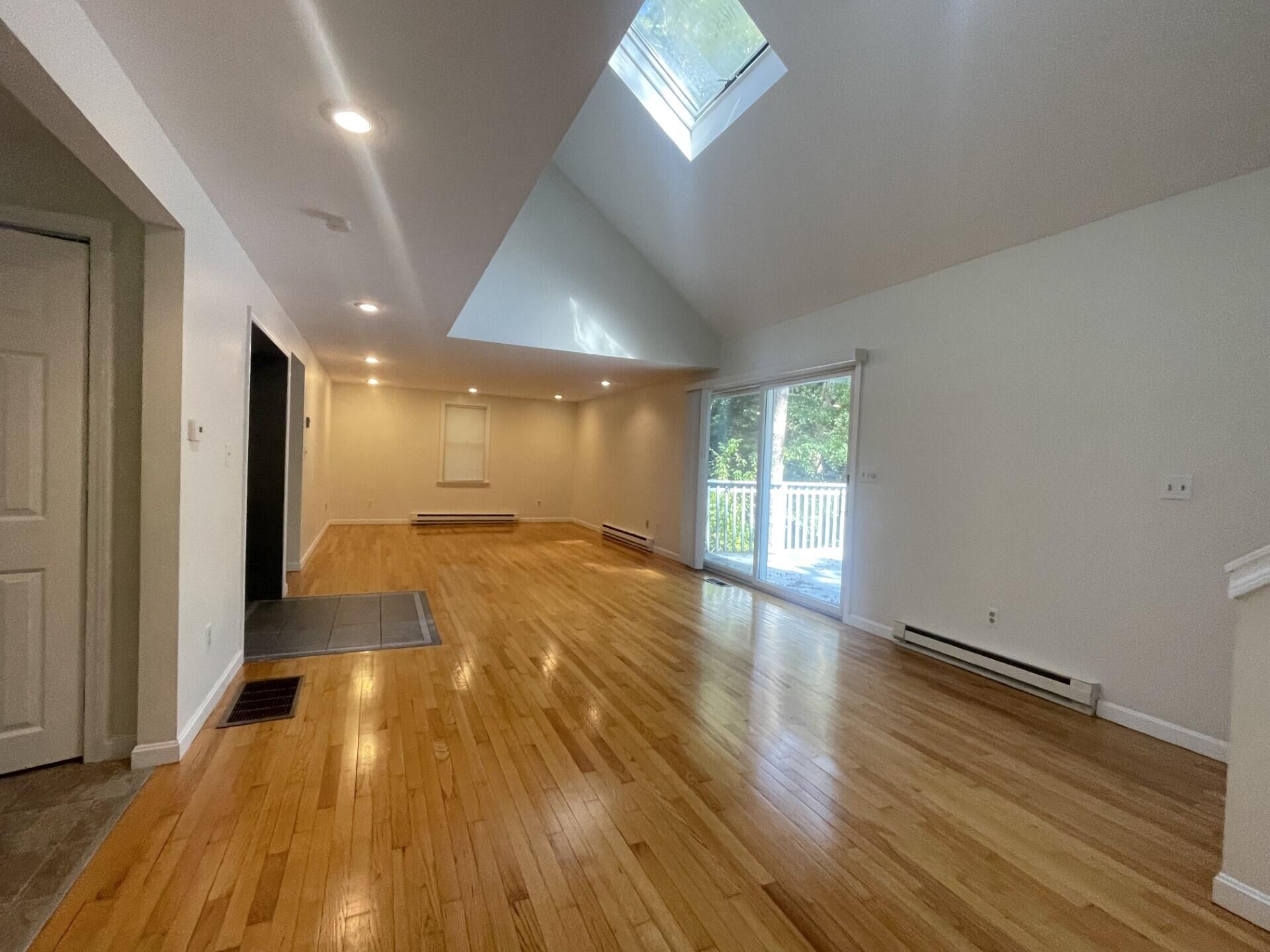 23 Radcliffe Road Mashpee, MA 02649 - Photo 4 of 20 a view of empty room with wooden floor