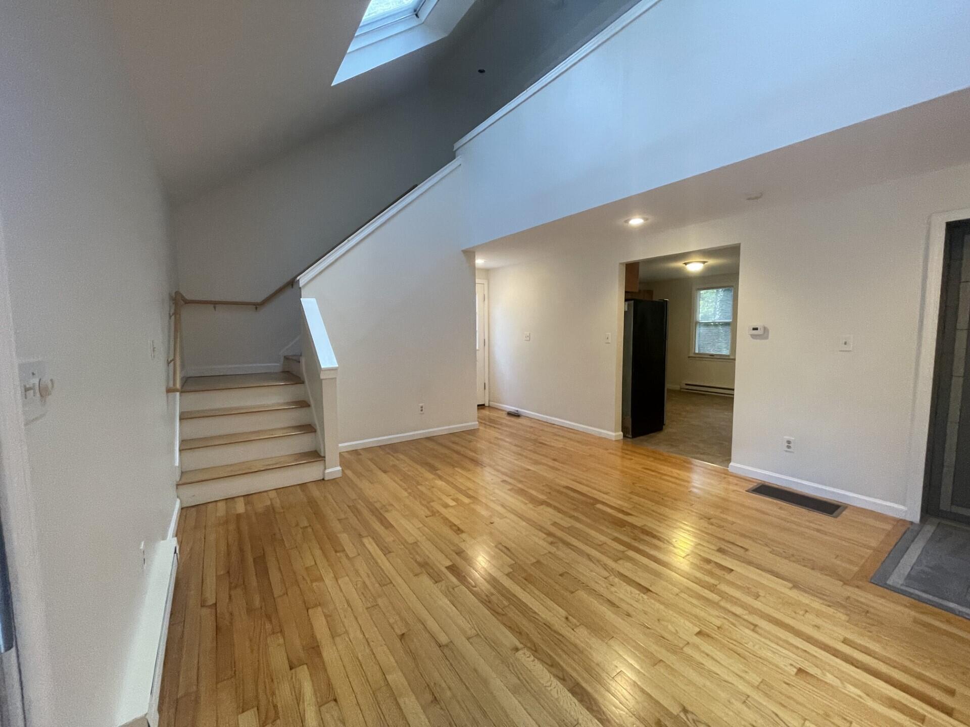 23 Radcliffe Road Mashpee, MA 02649 - Photo 7 of 20 a view of an empty room and wooden floor