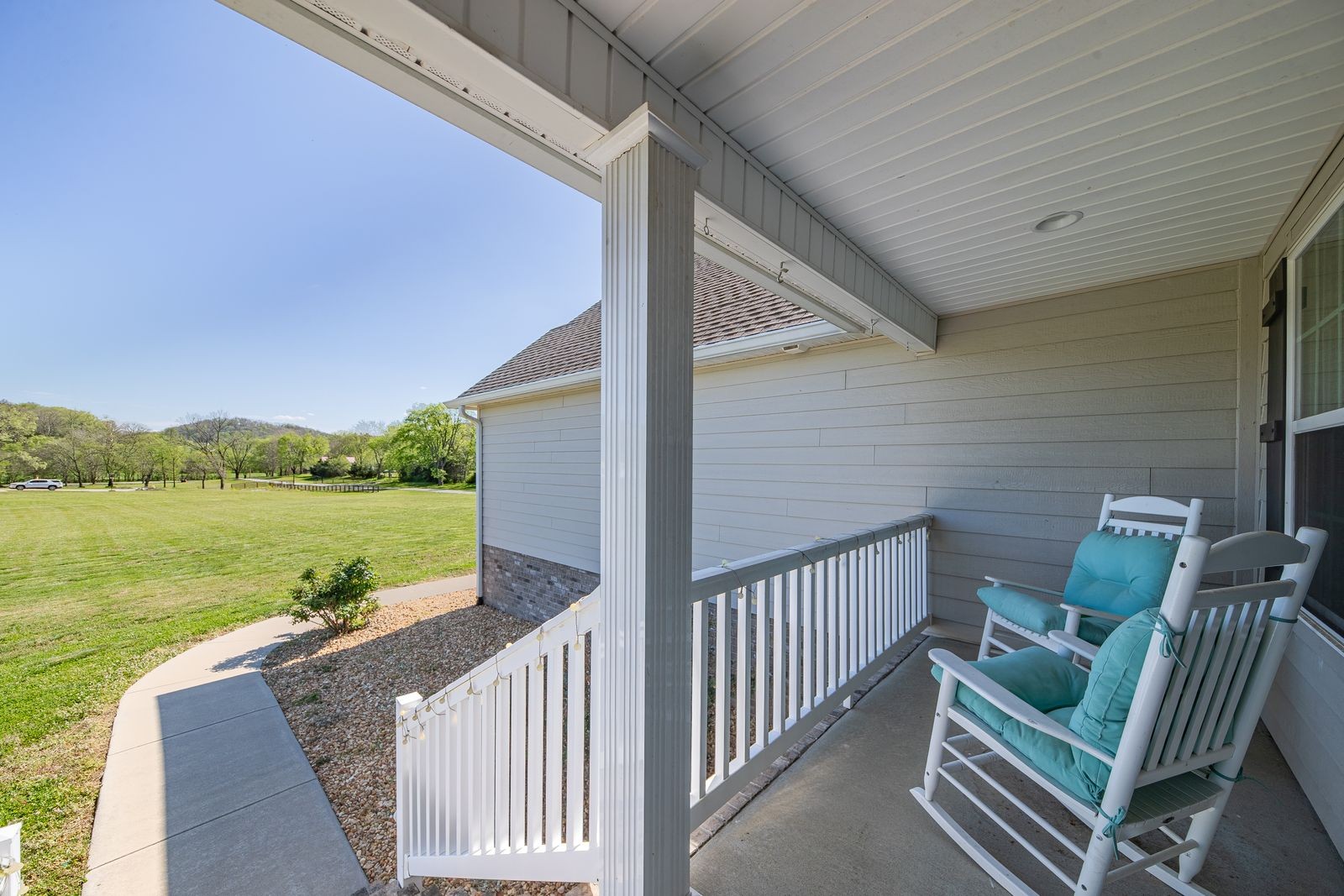 3036 Valley Creek Road Culleoka, TN 38451 - Photo 11 of 56 a view of a balcony with chair and wooden floor
