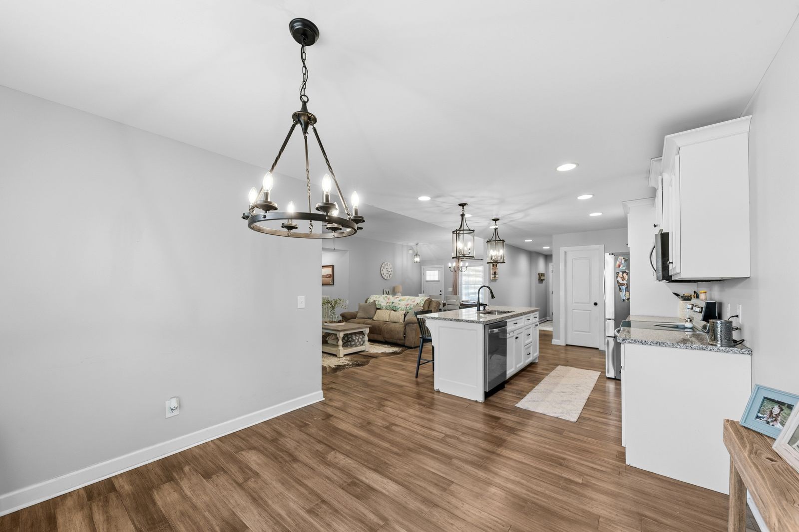 3036 Valley Creek Road Culleoka, TN 38451 - Photo 23 of 56 a view of a kitchen with kitchen island wooden floor center island and stainless steel appliances