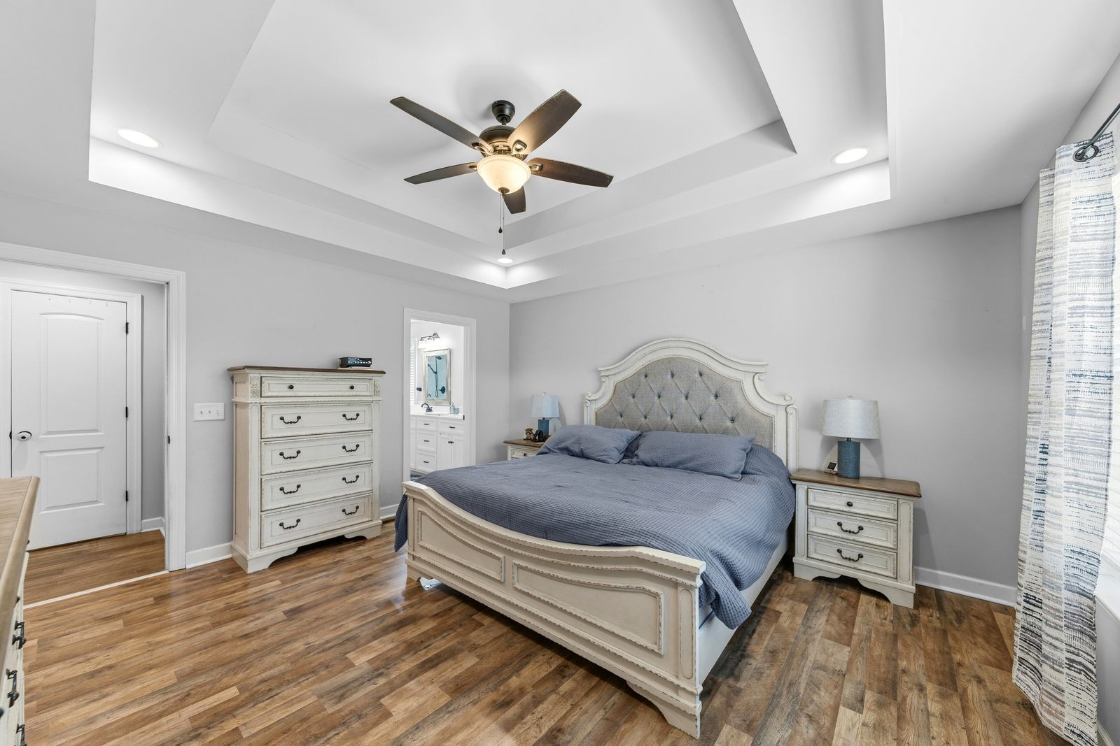 3036 Valley Creek Road Culleoka, TN 38451 - Photo 28 of 56 a bedroom with a bed and a chandelier