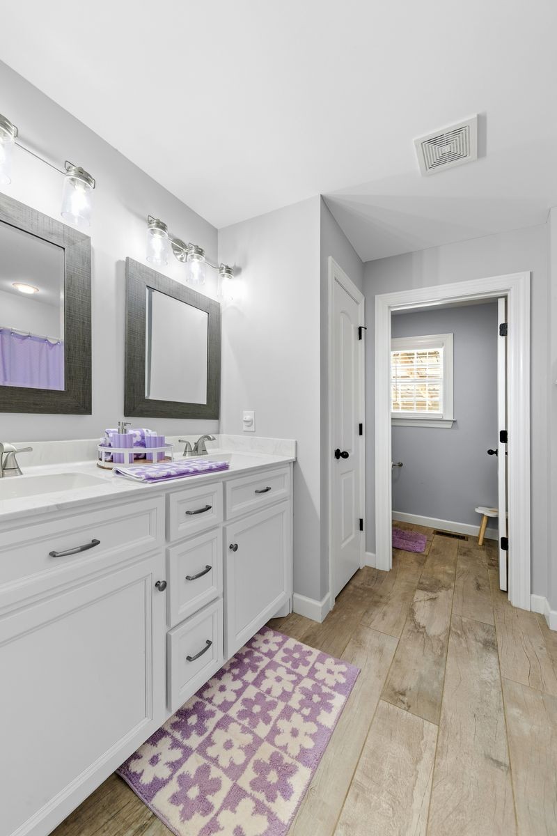 3036 Valley Creek Road Culleoka, TN 38451 - Photo 41 of 56 a bathroom with a sink double vanity and a mirror