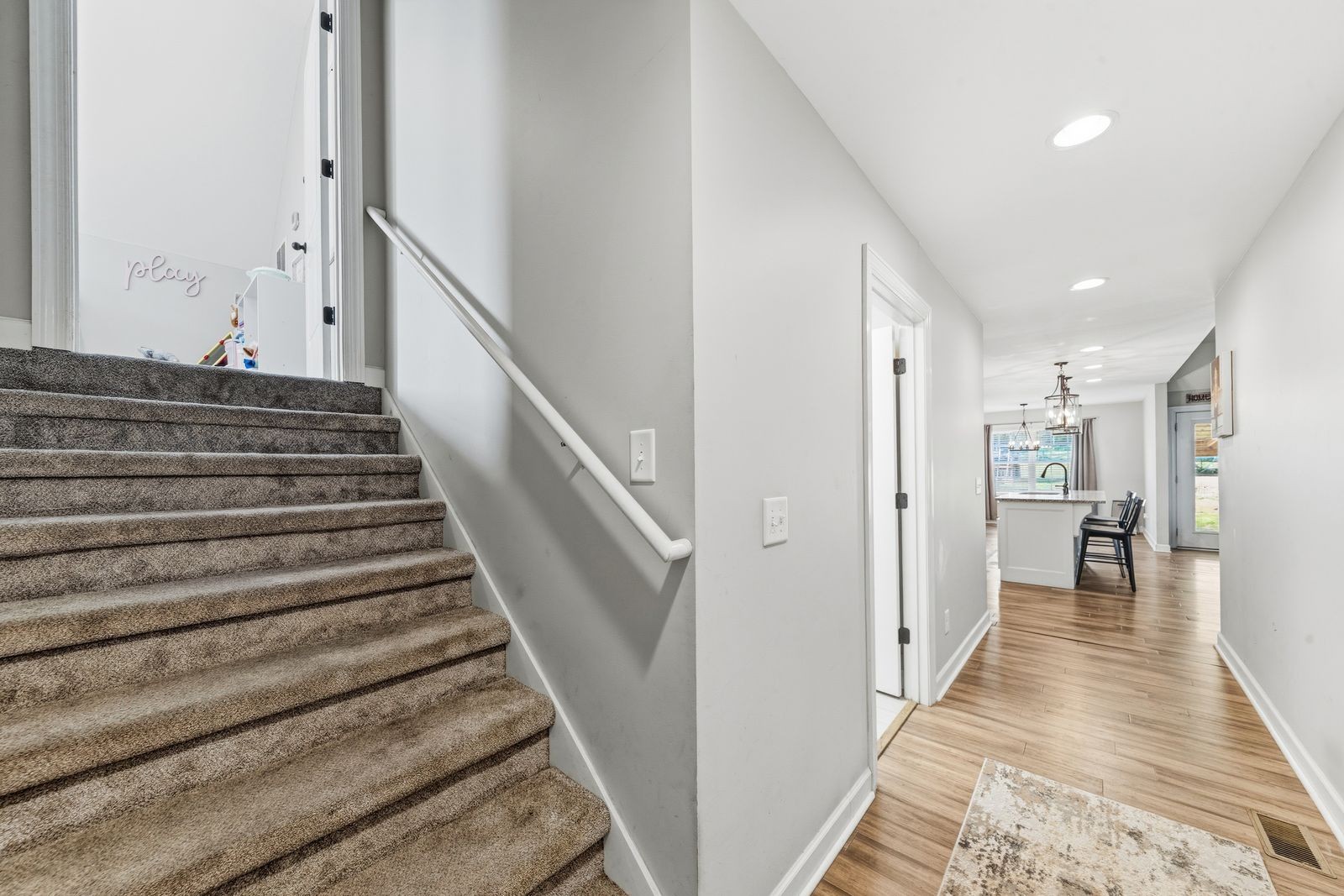 3036 Valley Creek Road Culleoka, TN 38451 - Photo 42 of 56 a view of a hallway with wooden floor and staircase