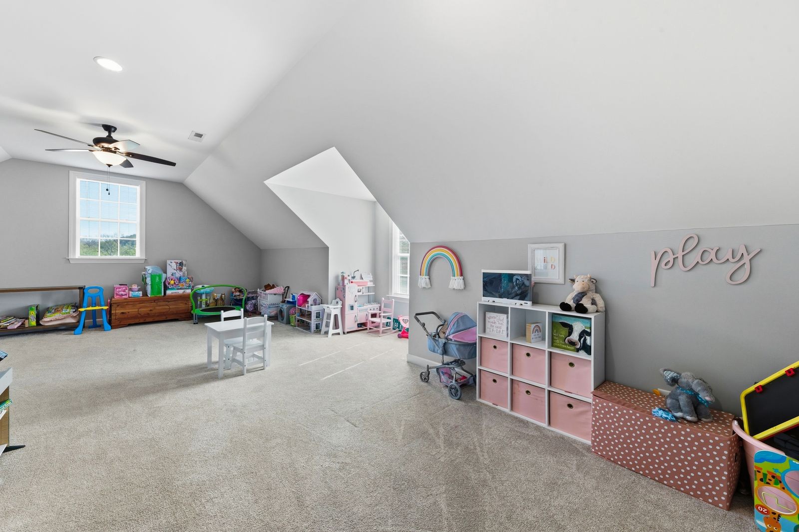 3036 Valley Creek Road Culleoka, TN 38451 - Photo 43 of 56 a view of a livingroom with toys and a ceiling fan