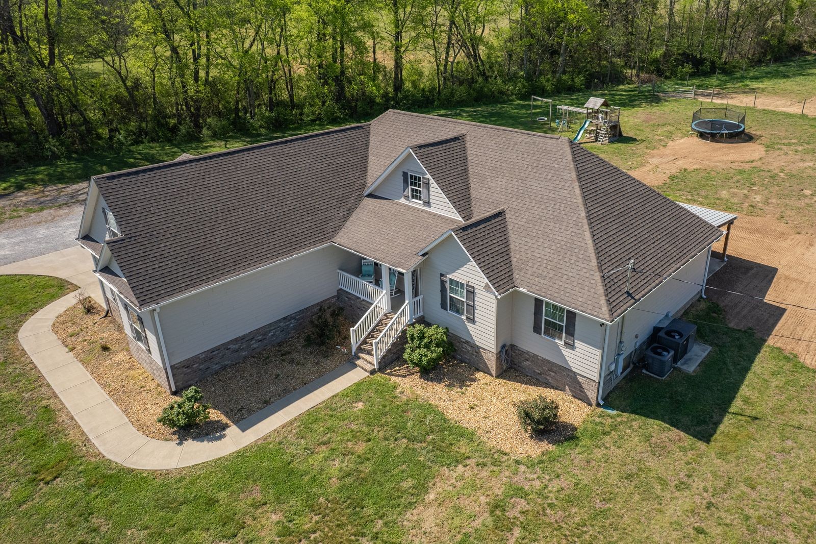 3036 Valley Creek Road Culleoka, TN 38451 - Photo 5 of 56 an aerial view of a house with swimming pool and trees in the background