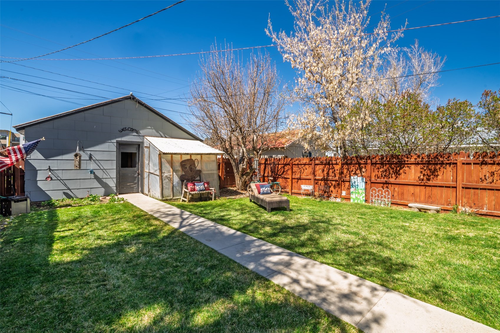 129 South Poplar Street Hayden, CO 81639 - Photo 24 of 26 Backyard and walkway to the detached garage/shop