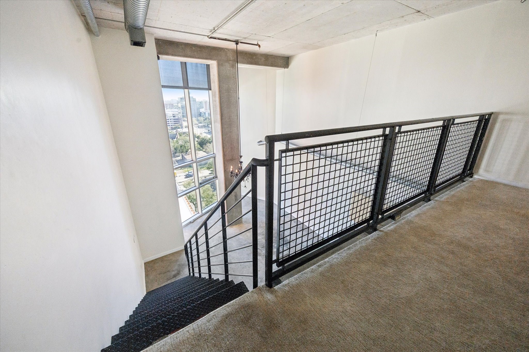 2000 Bagby Street, Unit 13432 Houston, TX 77002 - Photo 16 of 27 a view of staircase with railing and white walls