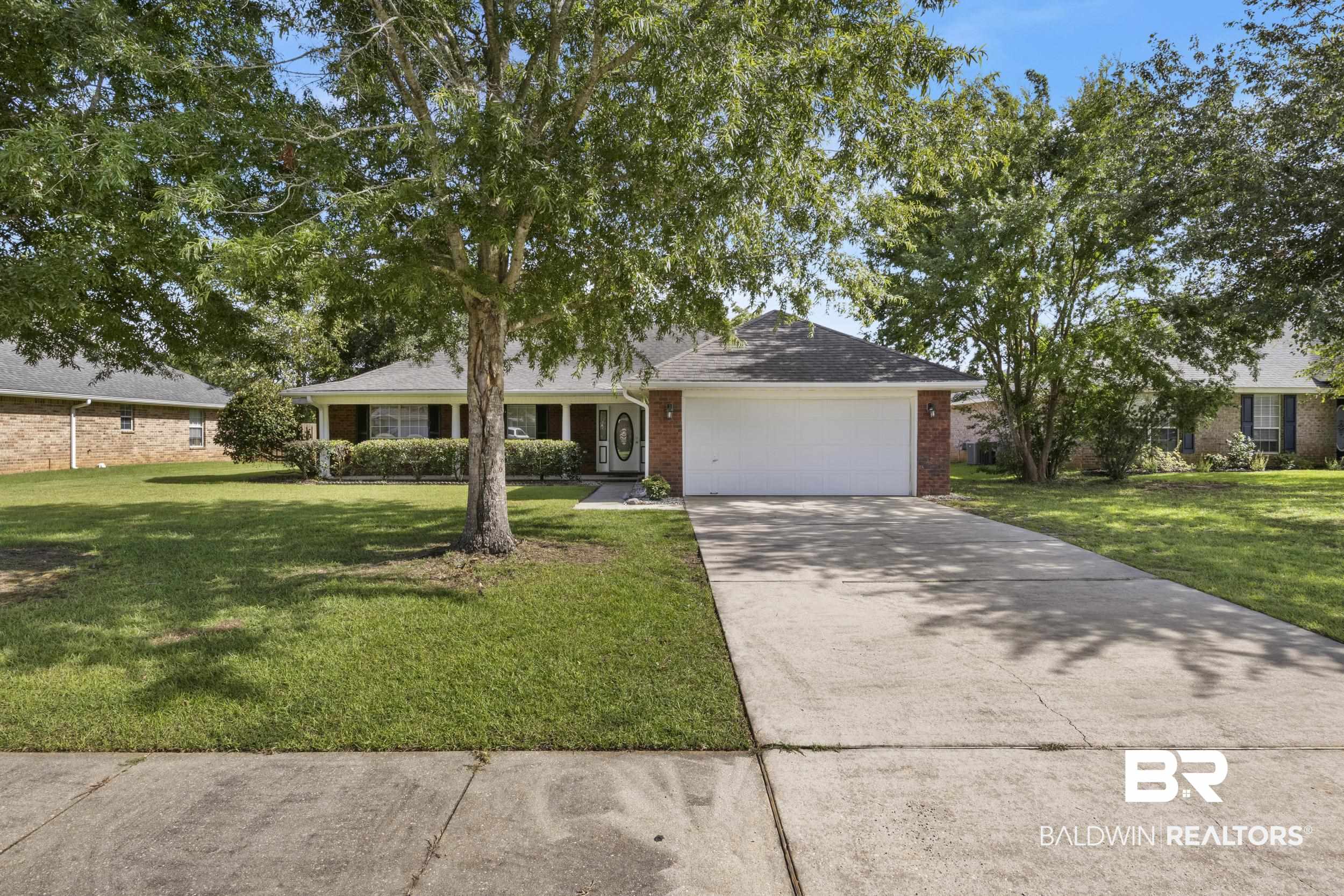 9610 Watkins Drive Fairhope, AL 36532 - Photo 26 of 26 Ranch-style house featuring a garage and a front lawn