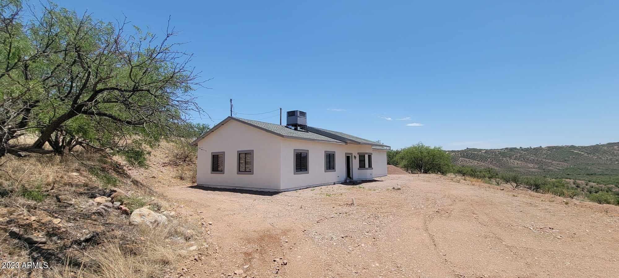 1115 Via Jacaranda Rio Rico, AZ 85648 - Photo 3 of 18 1145 Via Jacaranda front of house