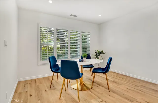 a kitchen with a sink and large window
