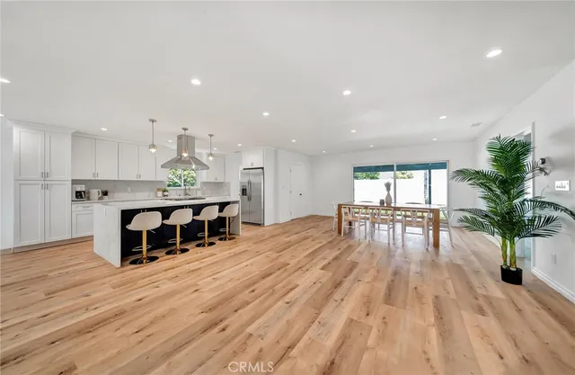 a view of a kitchen with a sink dryer and washer