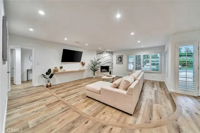 a view of a dining room with furniture and a wooden floor