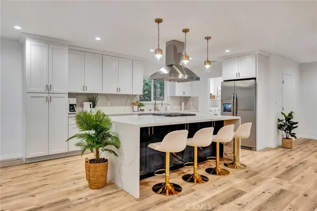 a view of a kitchen with washer and dryer