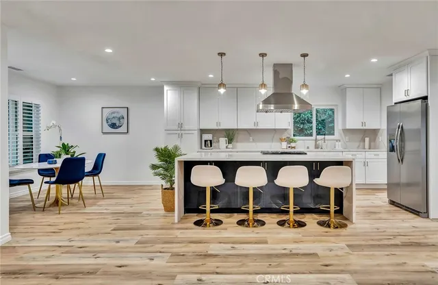 a bedroom with a bed and a potted plant
