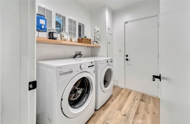 a white toilet sitting next to a bath tub