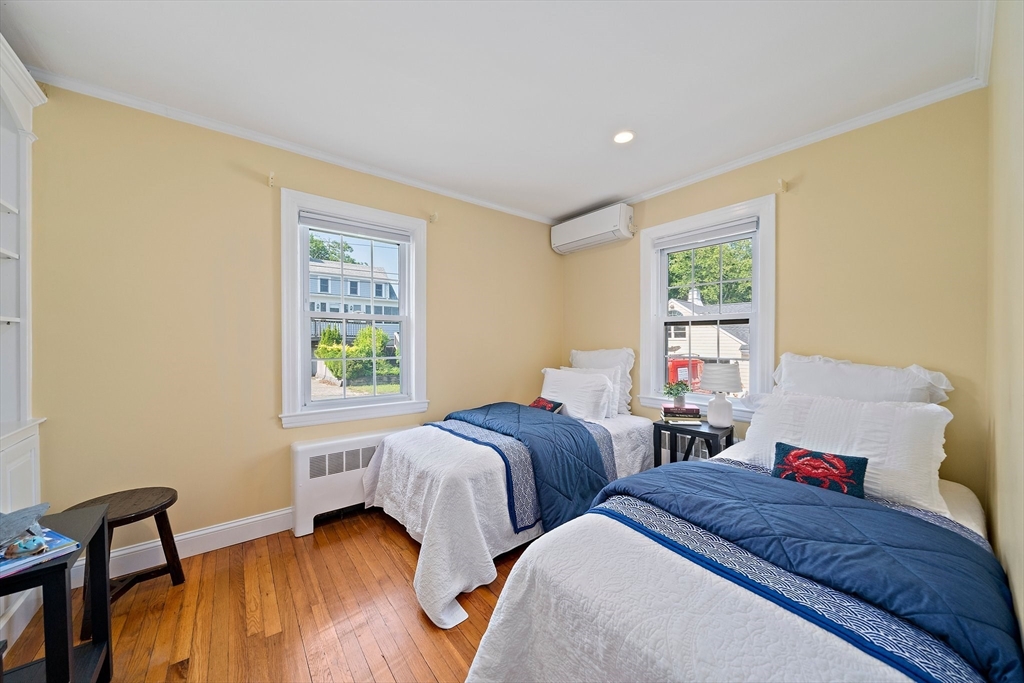 77 Jefferson Shores Road Wareham, MA 02532 - Photo 14 of 34 a bedroom with two beds and a window