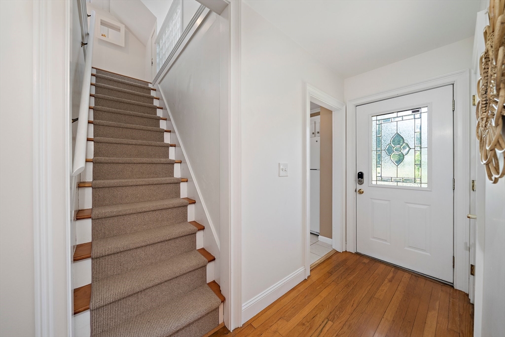 77 Jefferson Shores Road Wareham, MA 02532 - Photo 16 of 34 a view of entryway with stairs and wooden floor