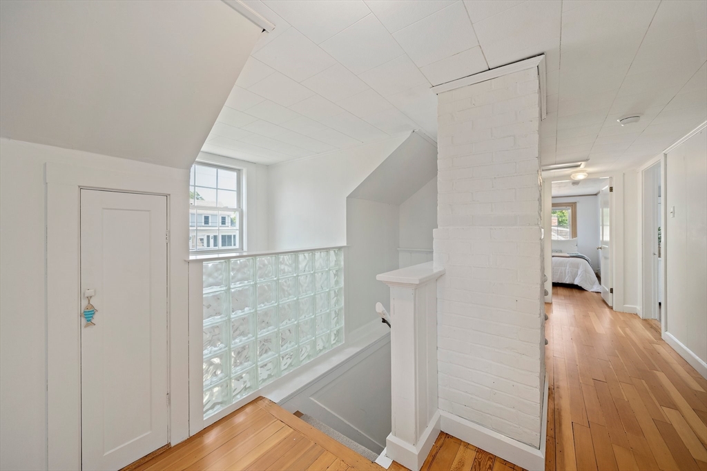 77 Jefferson Shores Road Wareham, MA 02532 - Photo 17 of 34 a view of a hallway with wooden floor and cabinet