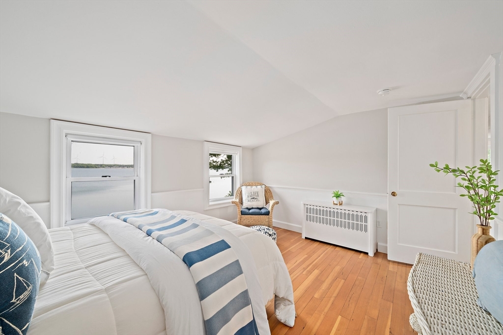 77 Jefferson Shores Road Wareham, MA 02532 - Photo 20 of 34 a bedroom with a bed and a couch