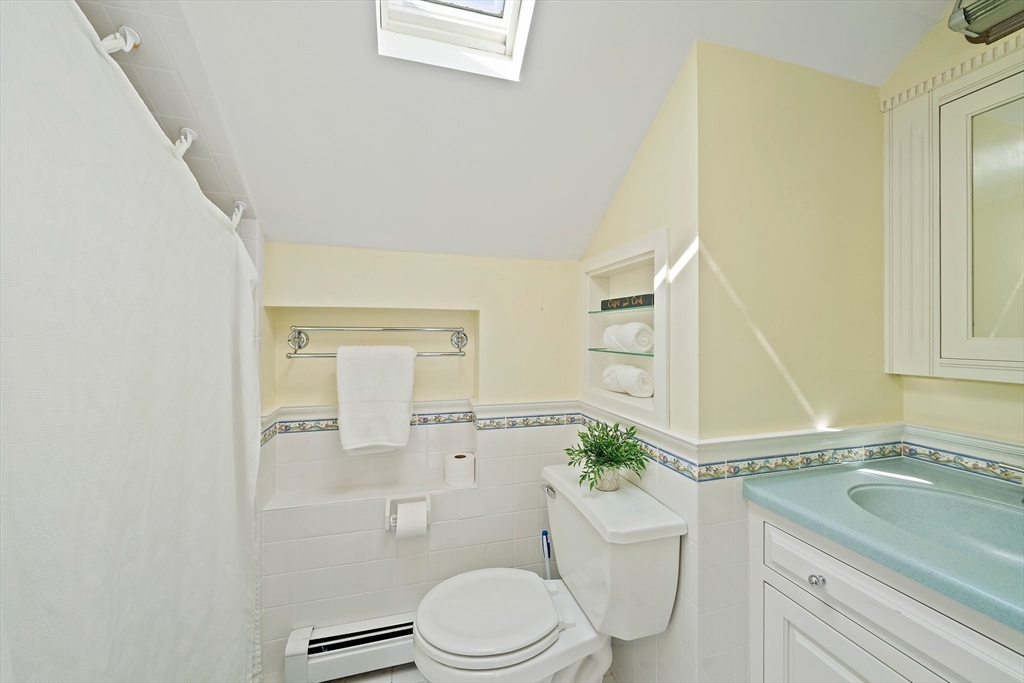 77 Jefferson Shores Road Wareham, MA 02532 - Photo 22 of 34 a bathroom with a granite countertop toilet sink and mirror