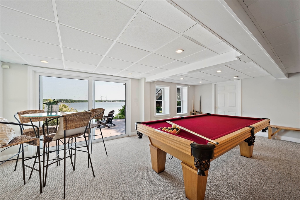 77 Jefferson Shores Road Wareham, MA 02532 - Photo 25 of 34 a kitchen with a table chairs and white walls