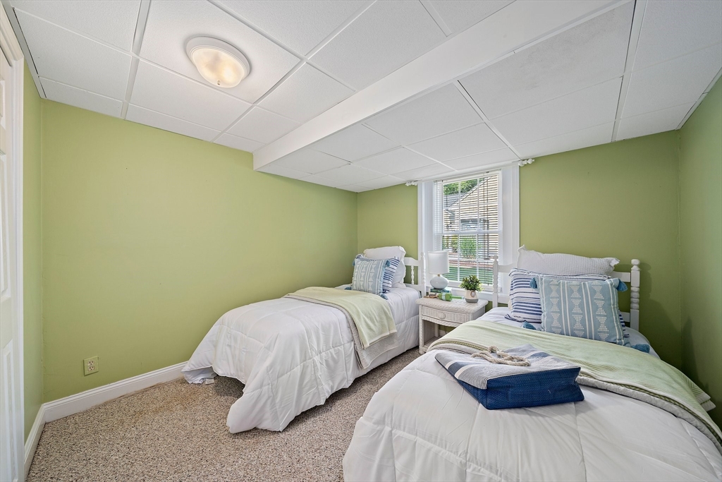 77 Jefferson Shores Road Wareham, MA 02532 - Photo 26 of 34 a bedroom with two beds and painted walls