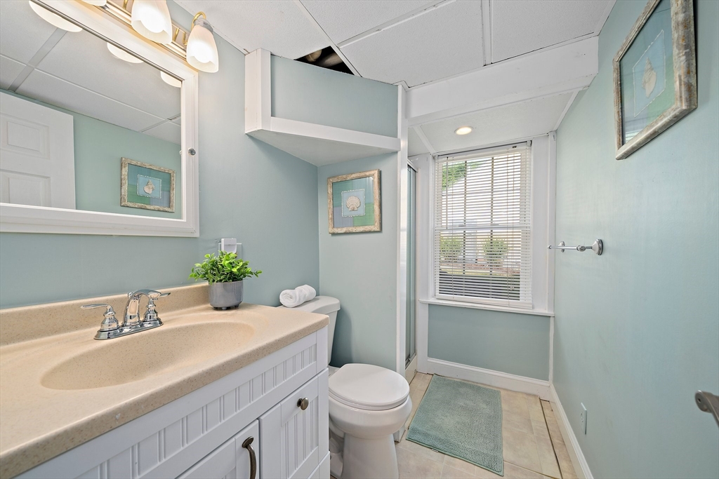 77 Jefferson Shores Road Wareham, MA 02532 - Photo 30 of 34 a bathroom with a sink toilet and shower