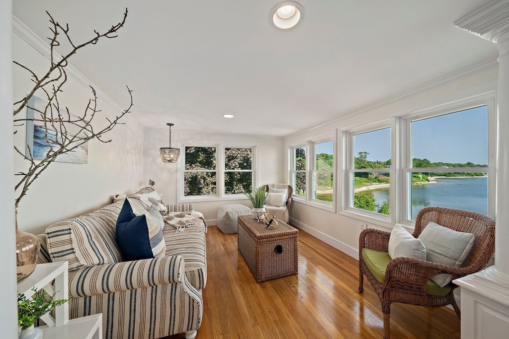 77 Jefferson Shores Road Wareham, MA 02532 - Photo 10 of 34 a living room with furniture and floor to ceiling windows