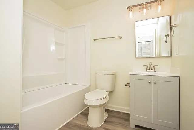 a bathroom with a toilet sink and a bathtub