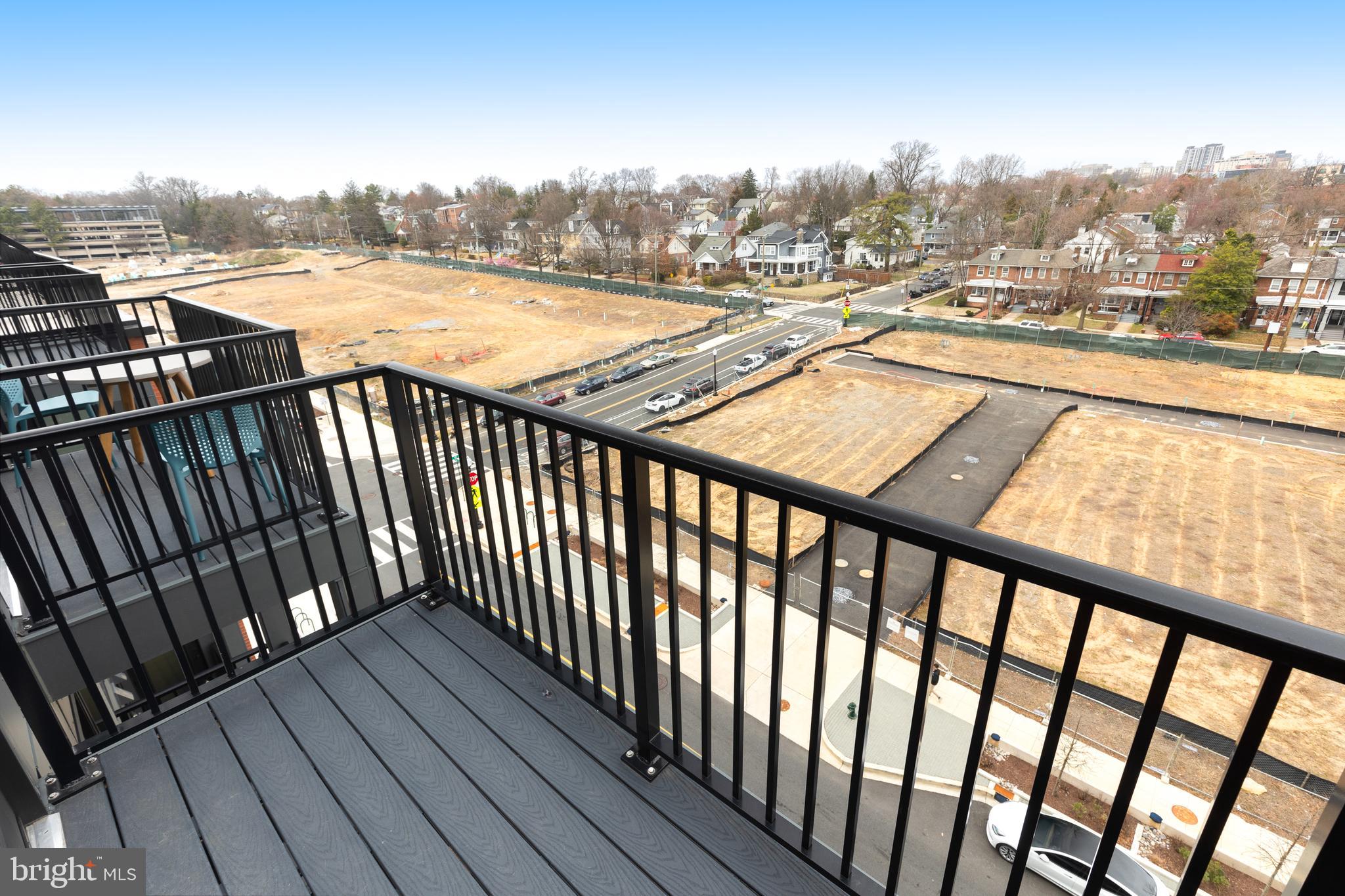 7175 12th Street Northwest, Unit 610 Washington, DC 20012 - Photo 22 of 35 a view of a balcony with wooden floor