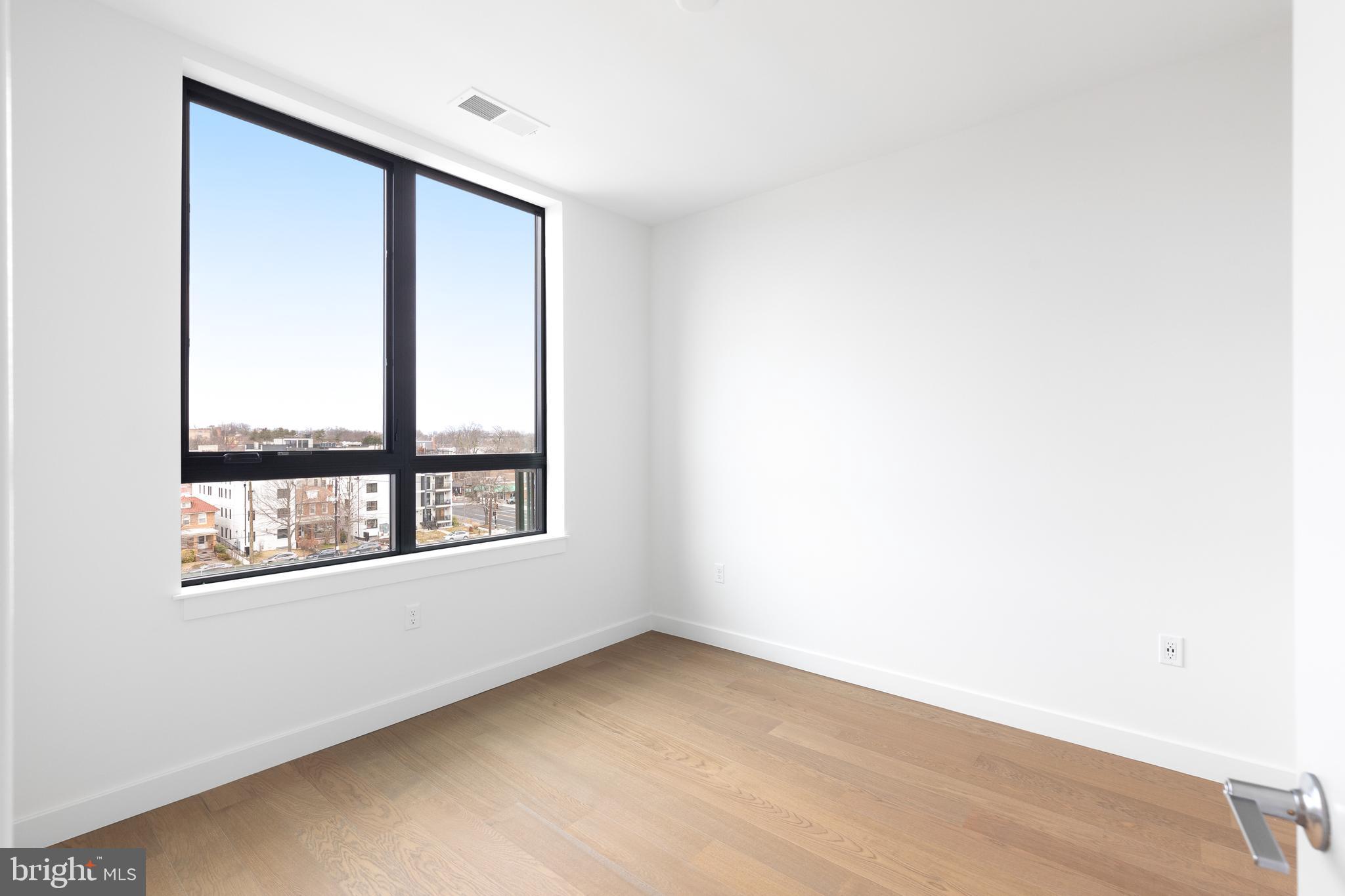 7175 12th Street Northwest, Unit 610 Washington, DC 20012 - Photo 3 of 35 an empty room with a window