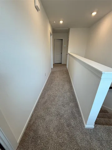 a view of hallway with stairs