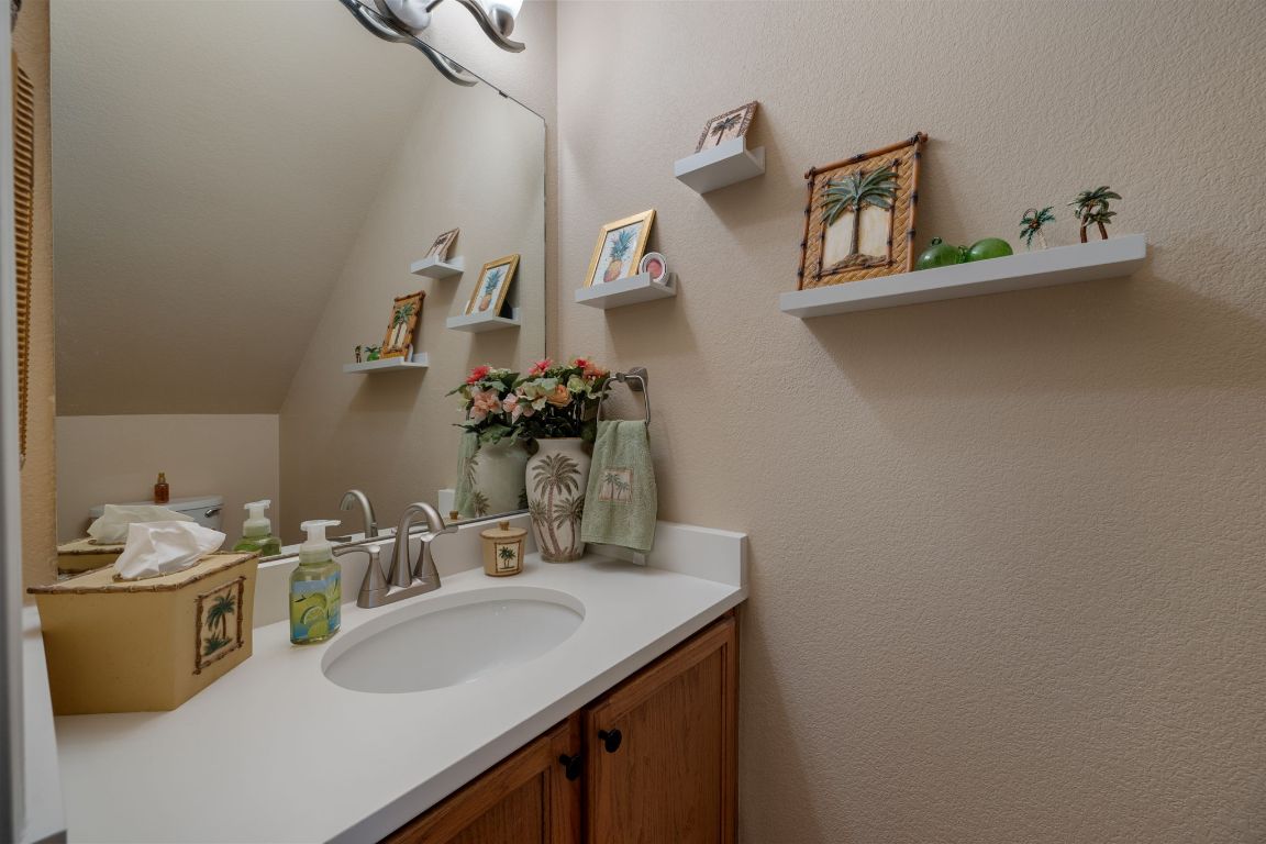6095 Negley, Unit A Kyle, TX 78640 - Photo 14 of 40 a bathroom with a sink and a mirror