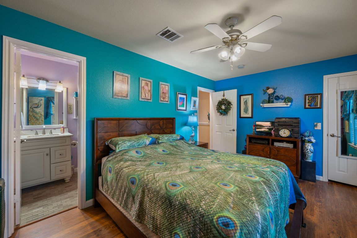 6095 Negley, Unit A Kyle, TX 78640 - Photo 17 of 40 a bed sitting in a bedroom next to a window