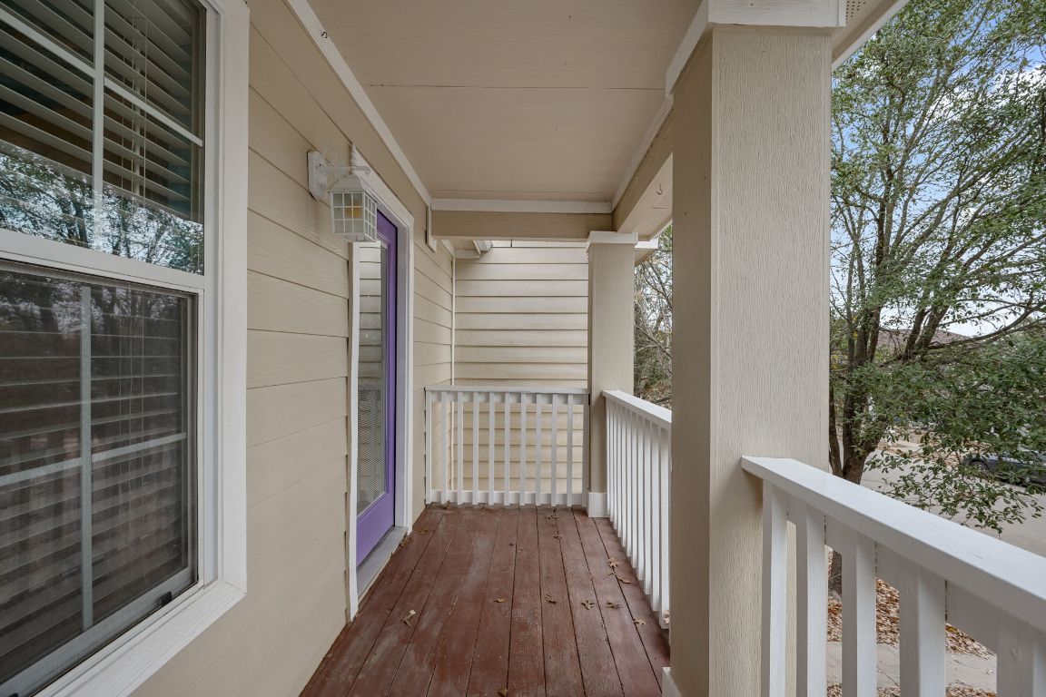6095 Negley, Unit A Kyle, TX 78640 - Photo 21 of 40 a view of a balcony with wooden floor and fence