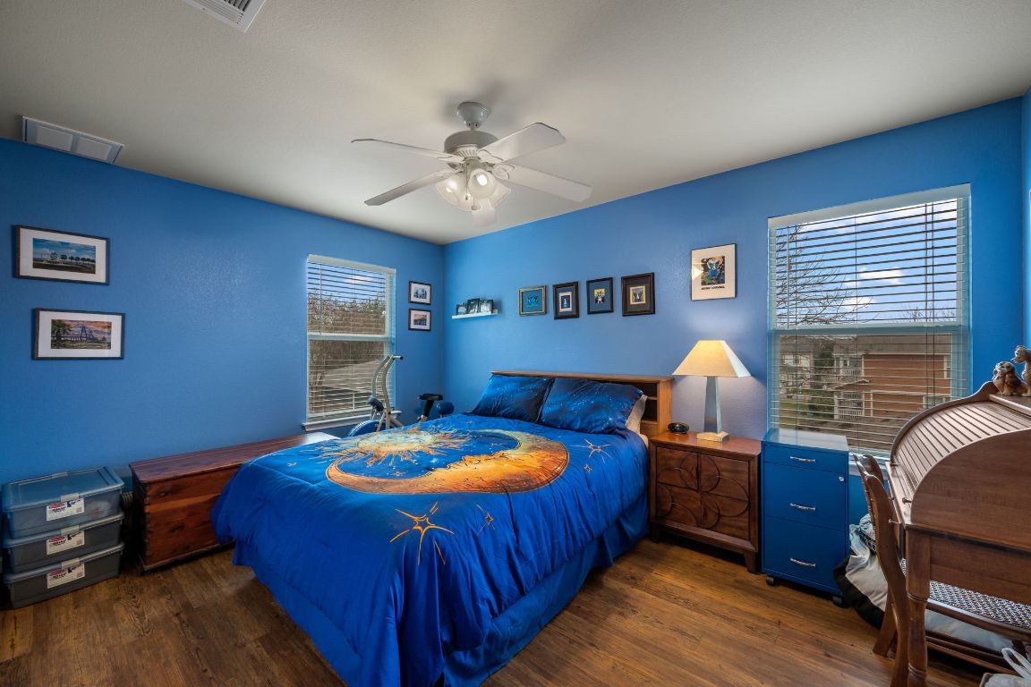 6095 Negley, Unit A Kyle, TX 78640 - Photo 22 of 40 a bedroom with bed and wooden floor