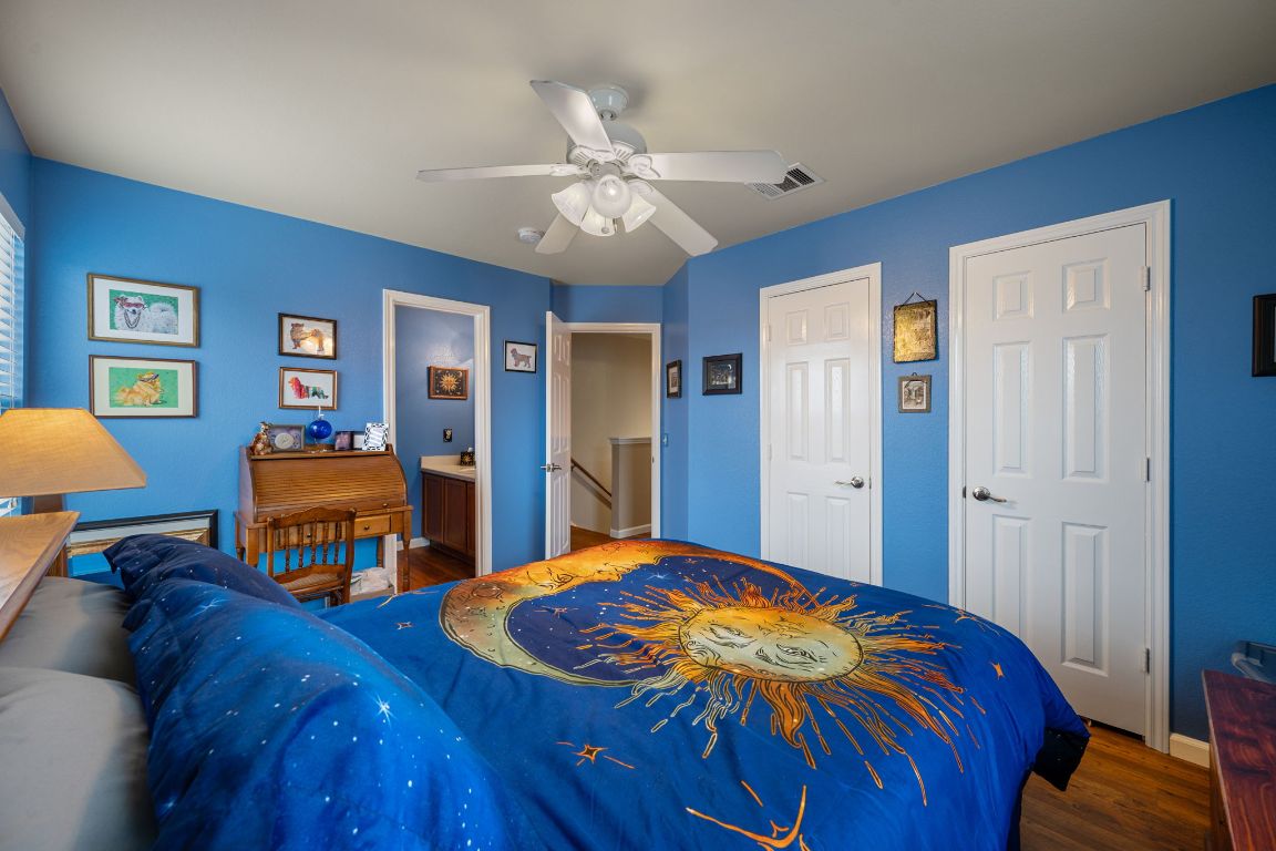 6095 Negley, Unit A Kyle, TX 78640 - Photo 23 of 40 a bedroom with a bed and a chandelier