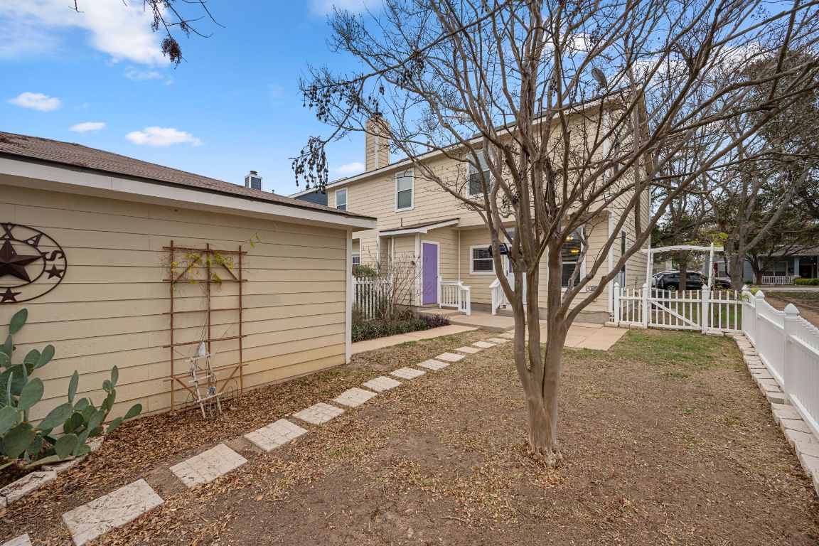 6095 Negley, Unit A Kyle, TX 78640 - Photo 28 of 40 a view of a house with a yard
