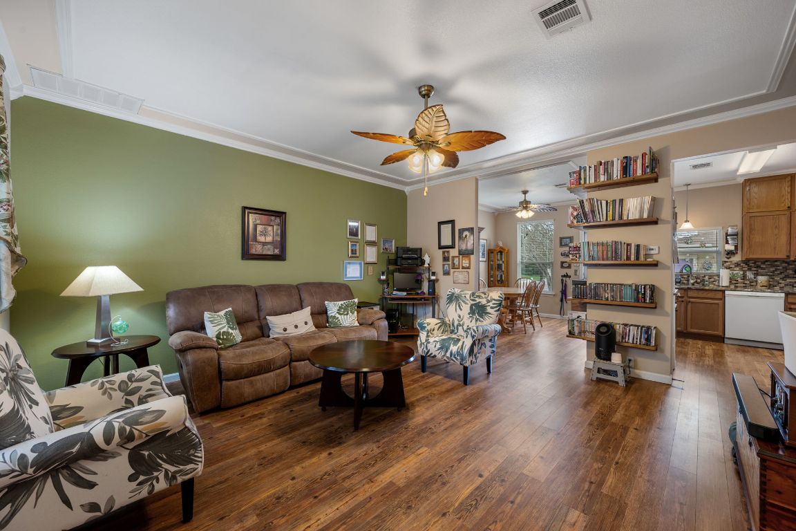 6095 Negley, Unit A Kyle, TX 78640 - Photo 3 of 40 a living room with furniture kitchen view and a wooden floor