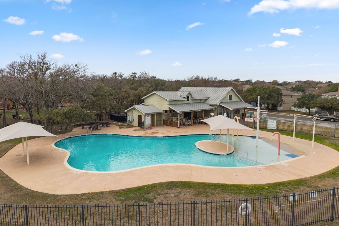 6095 Negley, Unit A Kyle, TX 78640 - Photo 35 of 40 a view of a swimming pool with a patio