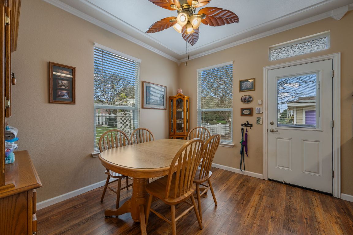 6095 Negley, Unit A Kyle, TX 78640 - Photo 7 of 40 a view of a dining room with furniture window and wooden floor
