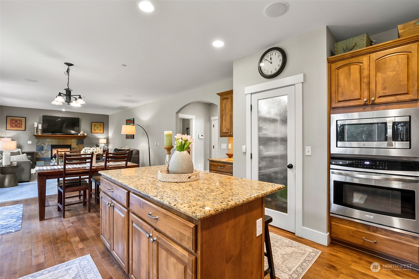 21808 31st Drive Southeast Bothell, WA 98021 - Photo 14 of 39 a kitchen with granite countertop stainless steel appliances and view of living room
