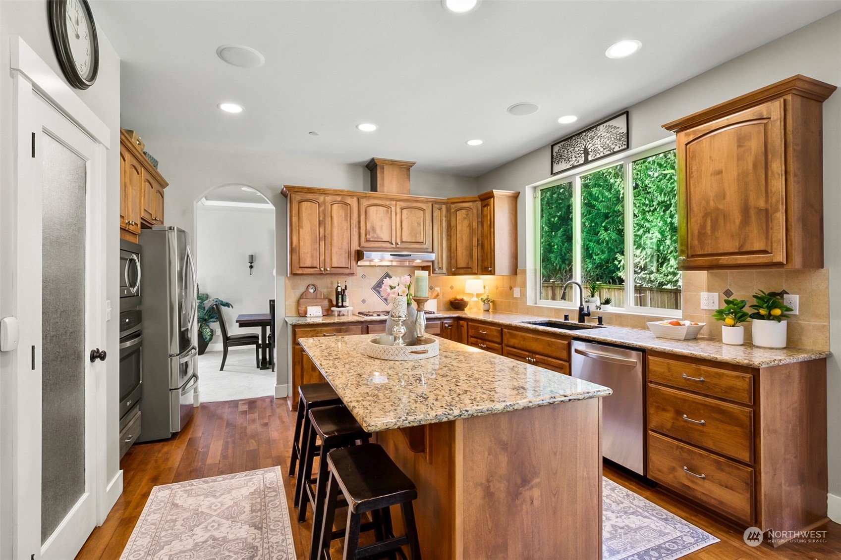 21808 31st Drive Southeast Bothell, WA 98021 - Photo 15 of 39 a kitchen with granite countertop lots of counter top space and stainless steel appliances