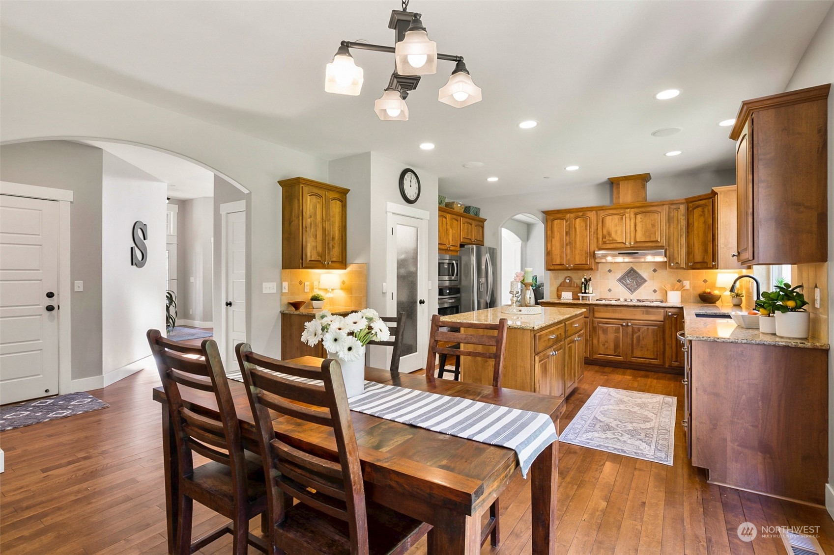 21808 31st Drive Southeast Bothell, WA 98021 - Photo 20 of 39 a view of a dining room with furniture and wooden floor