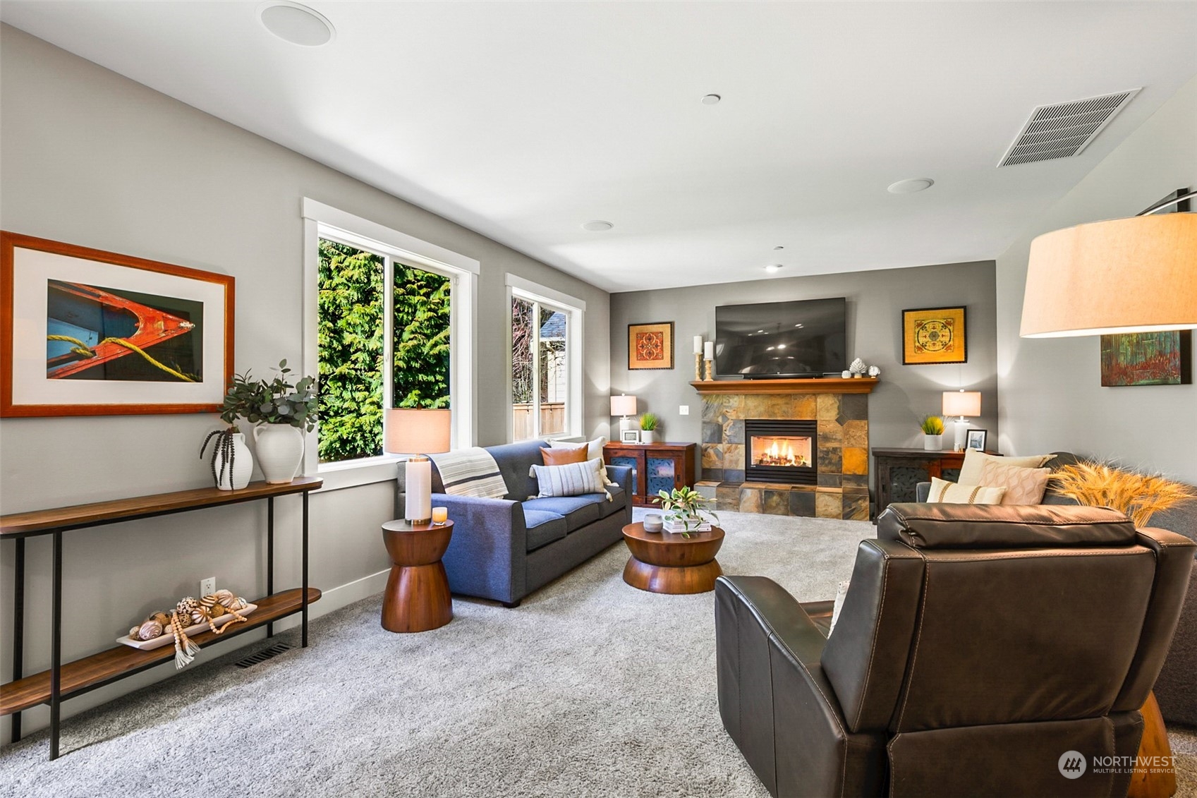 21808 31st Drive Southeast Bothell, WA 98021 - Photo 22 of 39 a living room with furniture fireplace and a large window